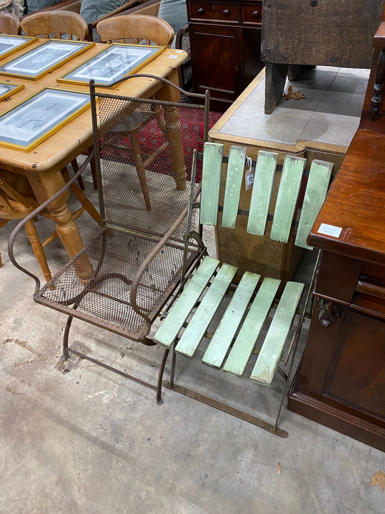 A Victorian folding iron garden chair and a later folding garden chair